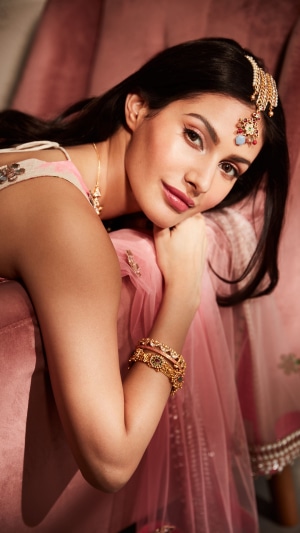 Amyra Dastur wearing traditional Indian jewelry and clothing