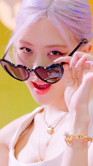 Rosé from BLACKPINK wearing heart sunglasses