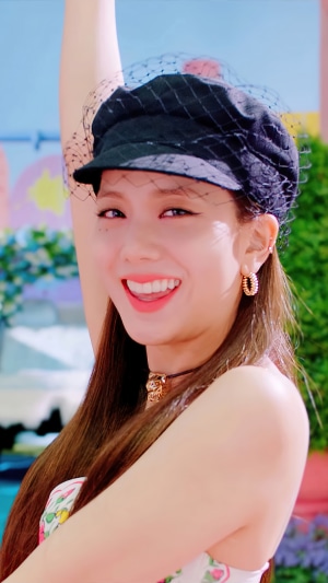Jisoo from BLACKPINK wearing a black hat and earrings