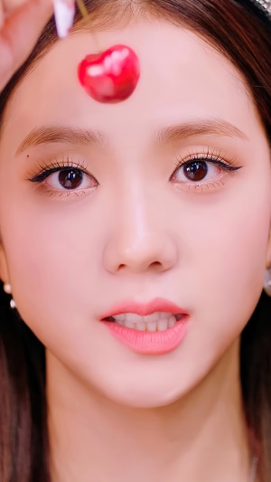 Jisoo from BLACKPINK with a cherry