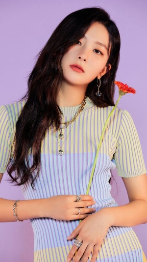 Seulgi from Red Velvet holding a flower