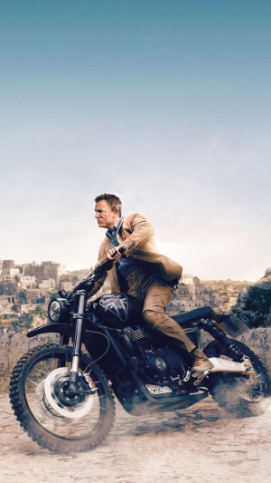 James Bond from No Time to Die riding a motorcycle