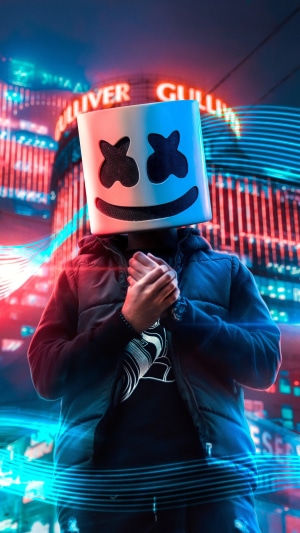 Marshmello DJ wearing his signature mask in a city at night