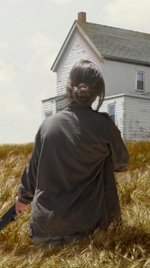 Ellie from The Last of Us Part II in a field