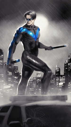 Nightwing from DC Comics standing on a car