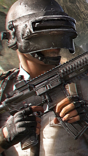 PlayerUnknown's Battlegrounds character with helmet and rifle