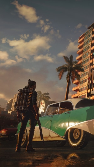 Dani Rojas from Far Cry 6 with a vintage car