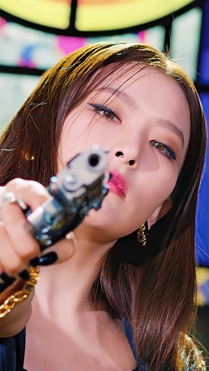 Seulgi from Red Velvet holding a gun