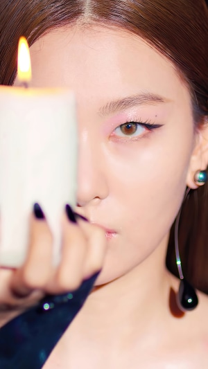 Seulgi from Red Velvet holding a candle