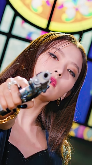 Seulgi from Red Velvet holding a gun