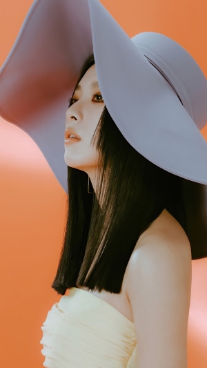 Seulgi from Red Velvet wearing a large hat