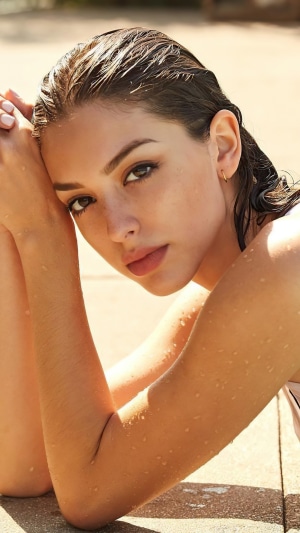 Celine Farach posing by the pool