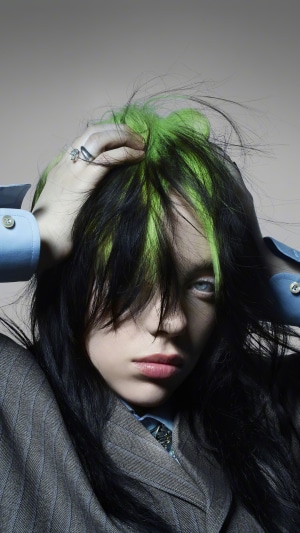 Billie Eilish with green and black hair