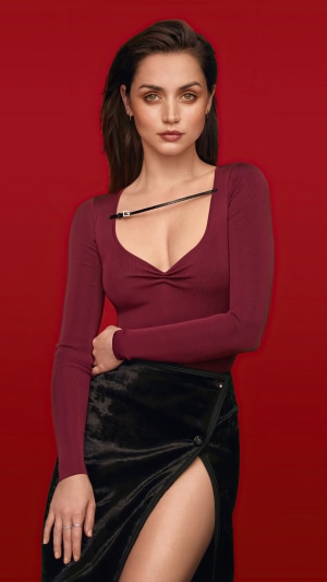 Ana de Armas in a maroon top and black skirt