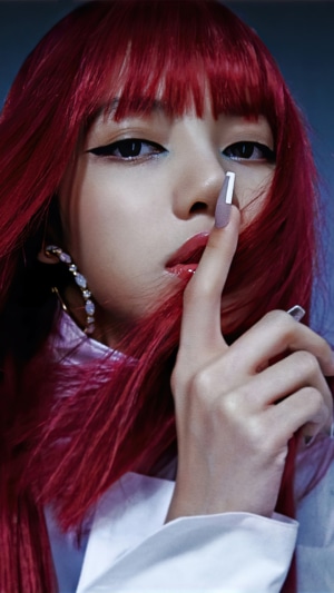 Lisa from BLACKPINK with red hair