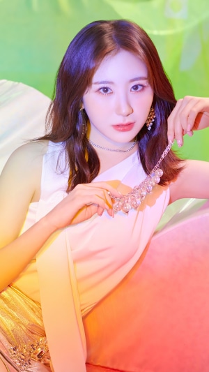 Chaeyeon from IZONE holding a necklace