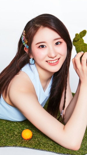 Lee Chaeyeon from IZONE posing with a bunny toy