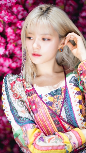 Jeongyeon from TWICE posing with pink flowers