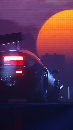 Sports car with spoiler at sunset