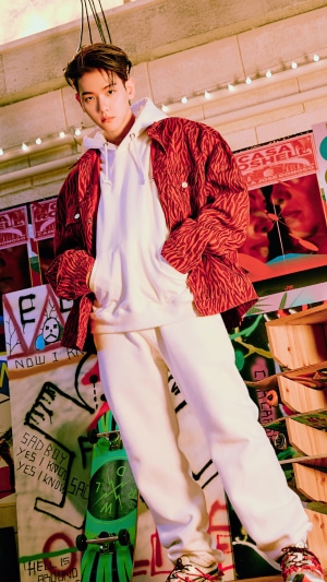 Baekhyun in a red patterned jacket and white hoodie