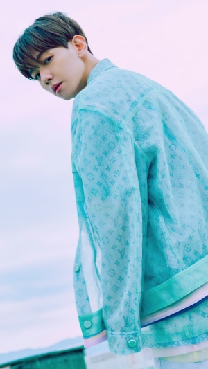 Baekhyun from Kpop wearing a blue Louis Vuitton jacket