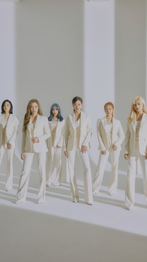 April Kpop group members in white suits