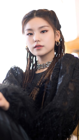 Yeji from ITZY with braided hair and chain necklace