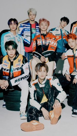 NCT 127 members in racing jackets