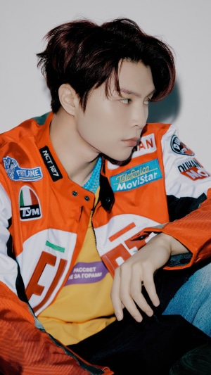 Johnny from NCT 127 wearing a racing jacket