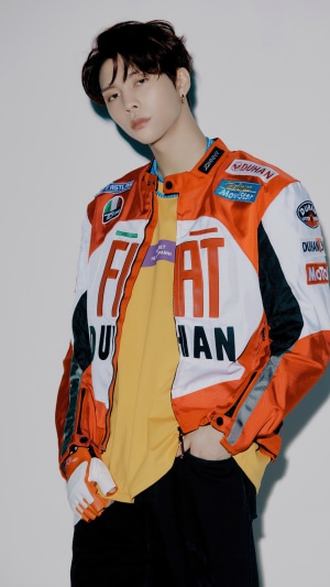 Johnny from NCT 127 wearing a racing jacket