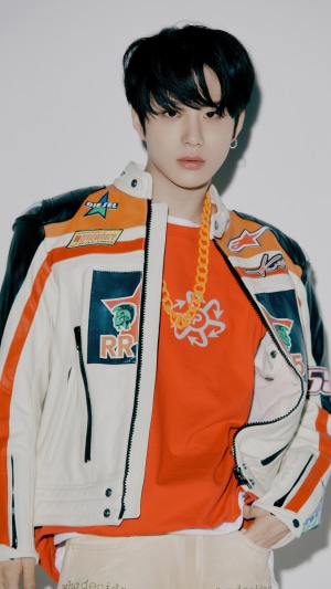 Jungwoo from NCT 127 wearing a racing jacket
