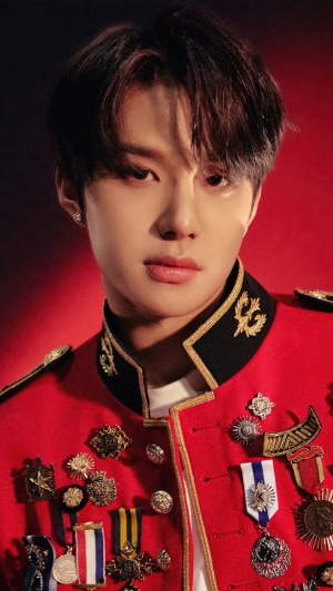 Jungwoo from NCT 127 in a red military-style uniform