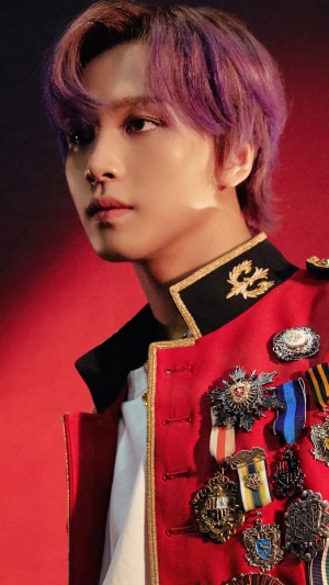 Haechan from NCT 127 in a red military-style jacket