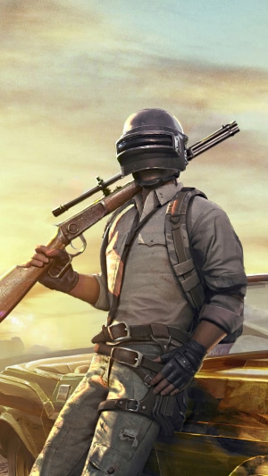 PlayerUnknown's Battlegrounds character with rifle and car