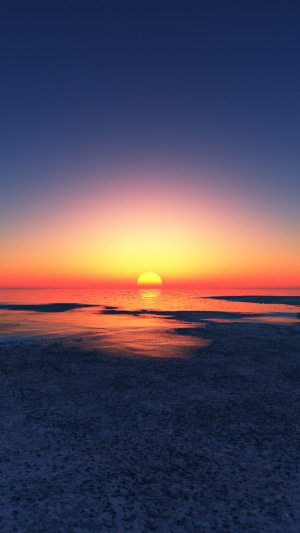 Sunset over the ocean with reflections on the water