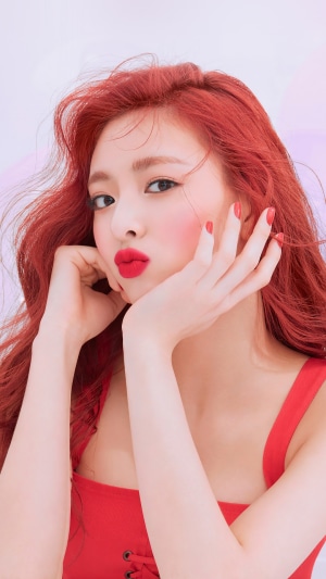 Shin Yuna from ITZY with red hair and red lips