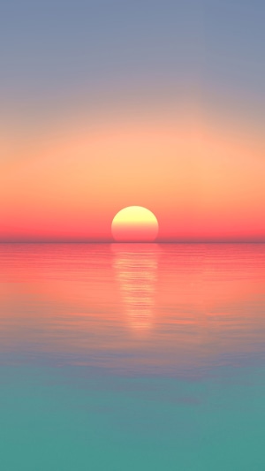 Sunset over the calm sea horizon