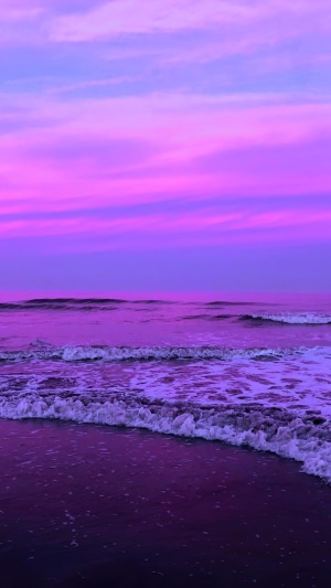 Purple Sunset Over Ocean Waves