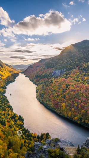 River valley with autumn foliage and mountains