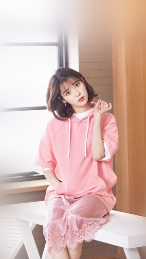 IU Lee Ji Eun in pink hoodie and skirt