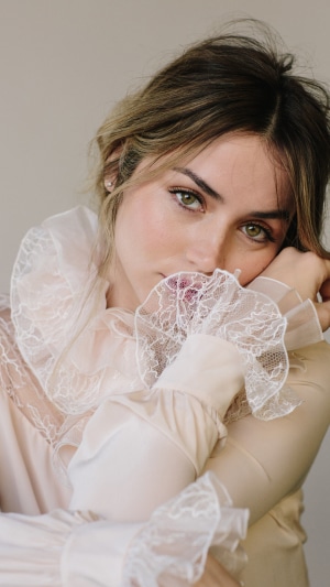 Ana de Armas posing with her hands near her face