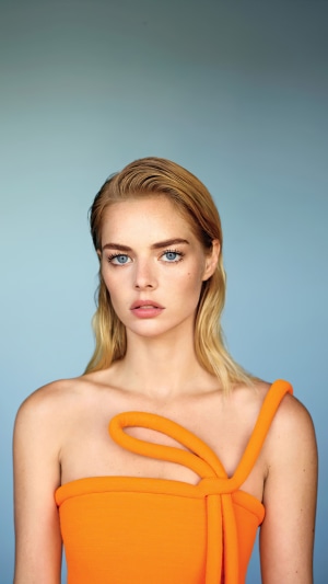 Samara Weaving in orange top