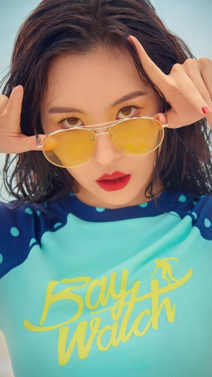 Sunmi wearing sunglasses and a Baywatch swimsuit