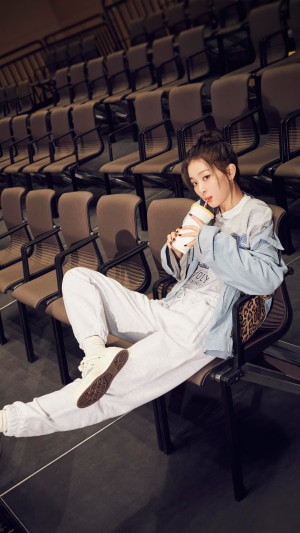 Kang Seul Gi from Red Velvet drinking from a cup