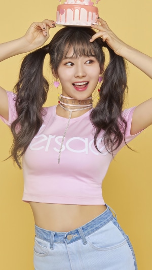 Sana from TWICE holding a cake