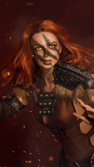Cosplayer dressed as a Skyrim warrior with face paint