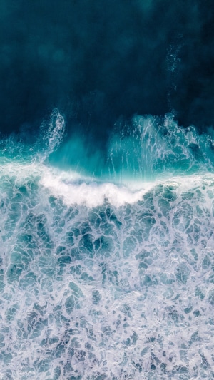 Aerial view of ocean waves crashing