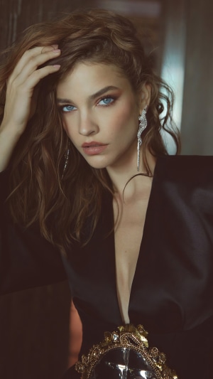 Barbara Palvin in a black dress with ornate embellishments
