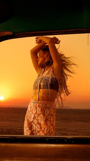 Olivia Wilde dancing at sunset