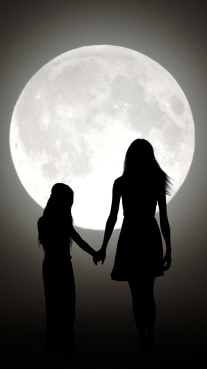 Two figures silhouetted against a large moon